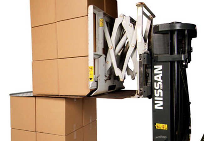 Slip sheet handling in a warehouse environment